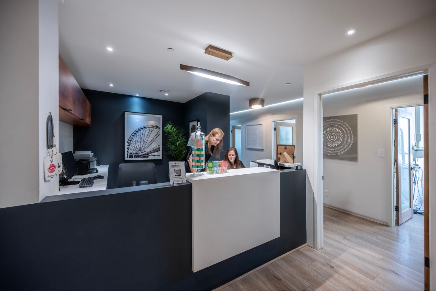 Modern dental reception with a polished front desk and clean floors